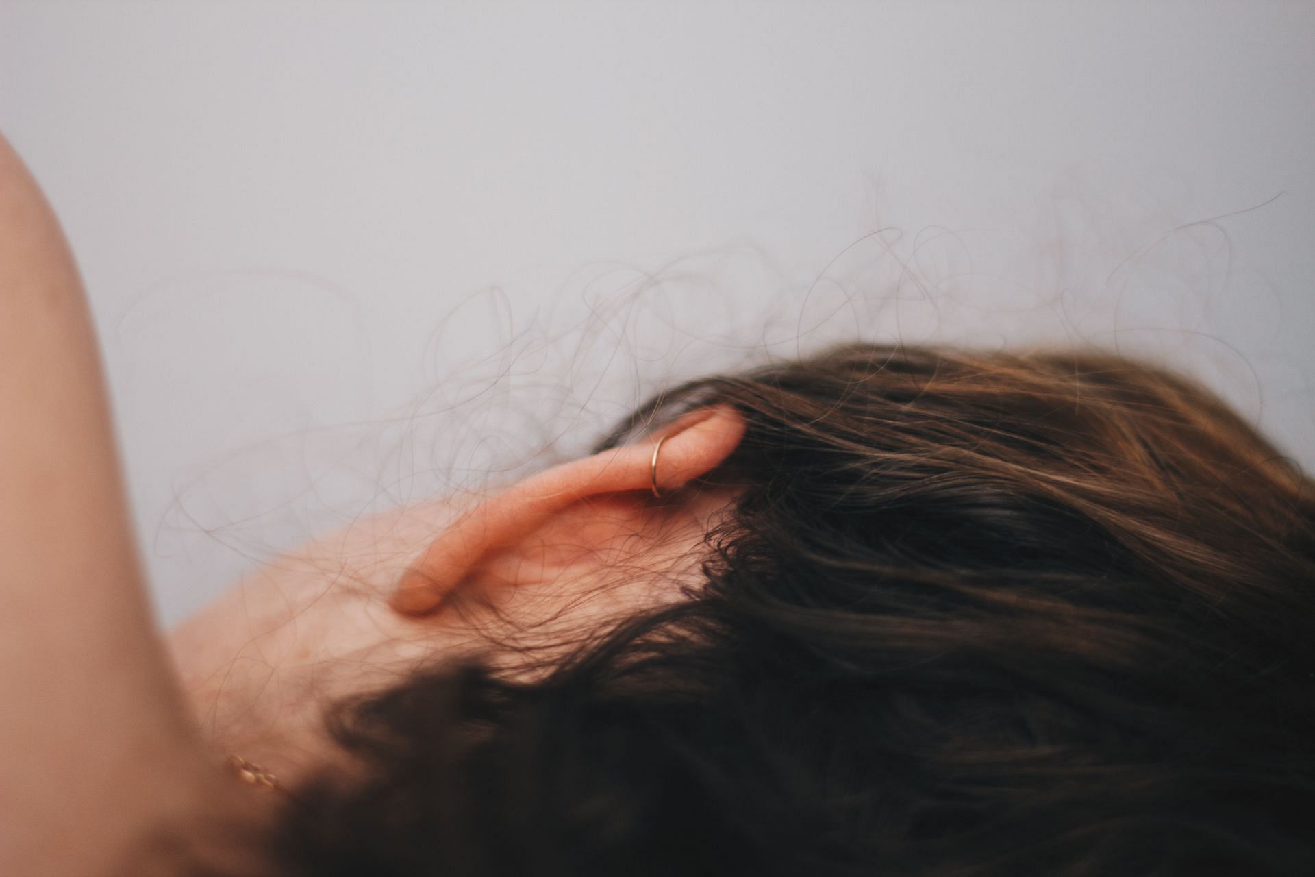 Earwax buildup can clog ear canal. (Image via Unsplash/ Hayes Potter)